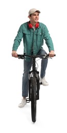 Smiling man with headphones riding bicycle on white background