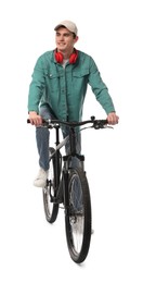Photo of Smiling man with headphones riding bicycle on white background