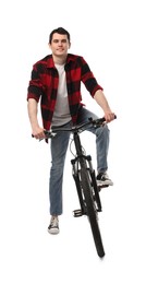 Smiling man on bicycle against white background