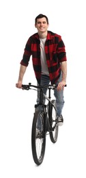 Smiling man riding bicycle on white background