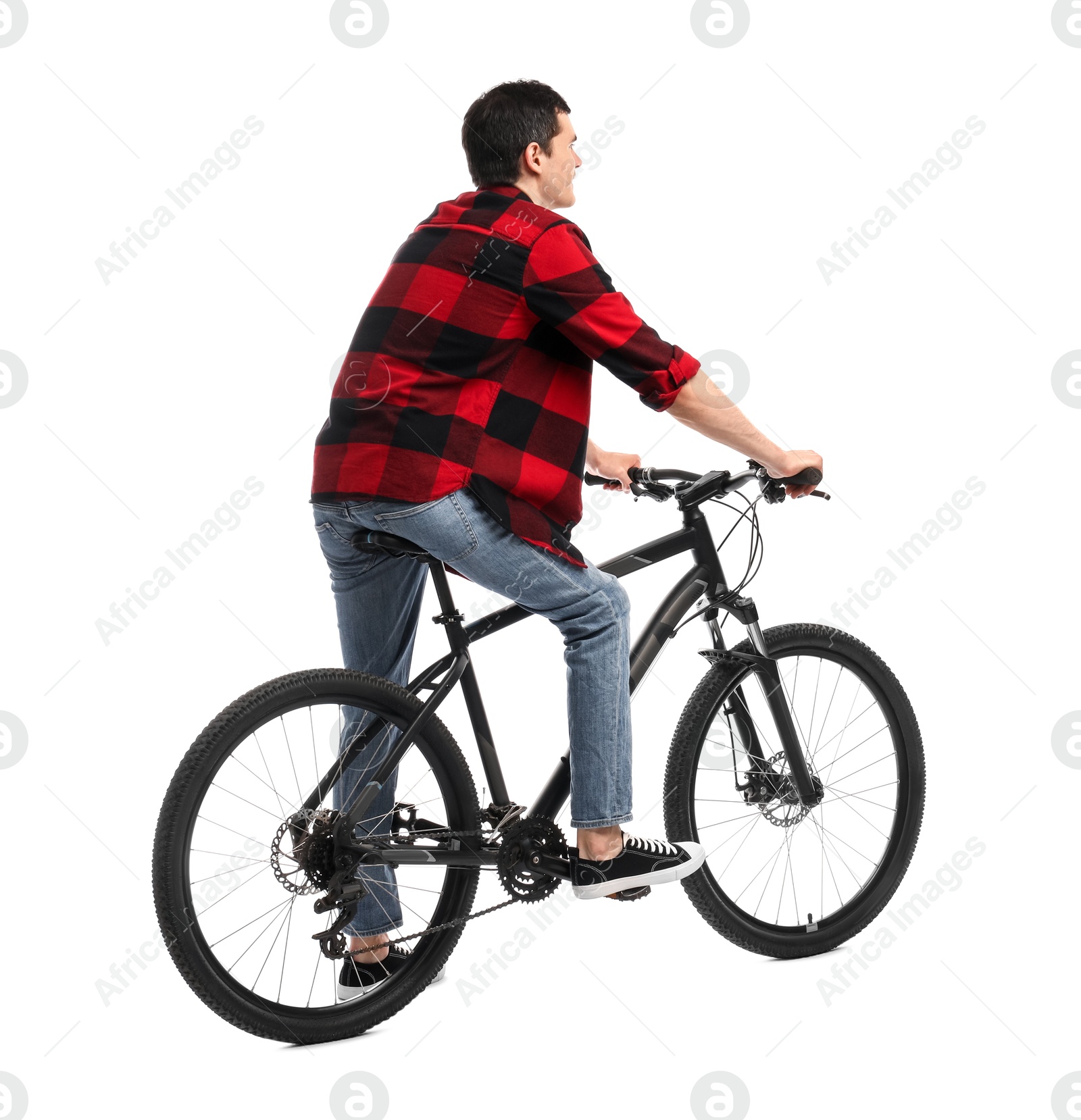 Photo of Young man riding bicycle on white background