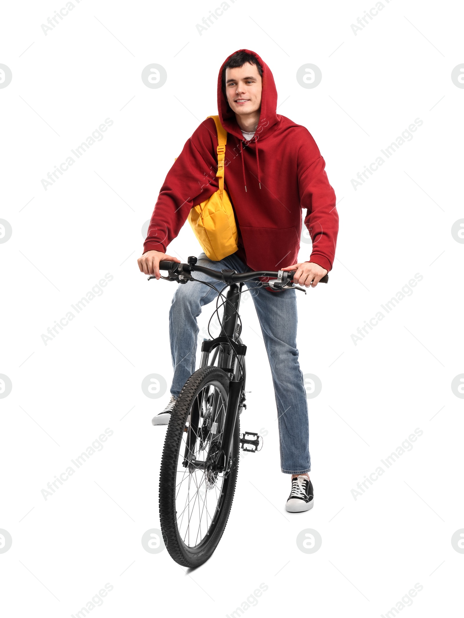 Photo of Smiling man with backpack riding bicycle on white background