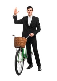 Smiling man with bicycle and basket isolated on white