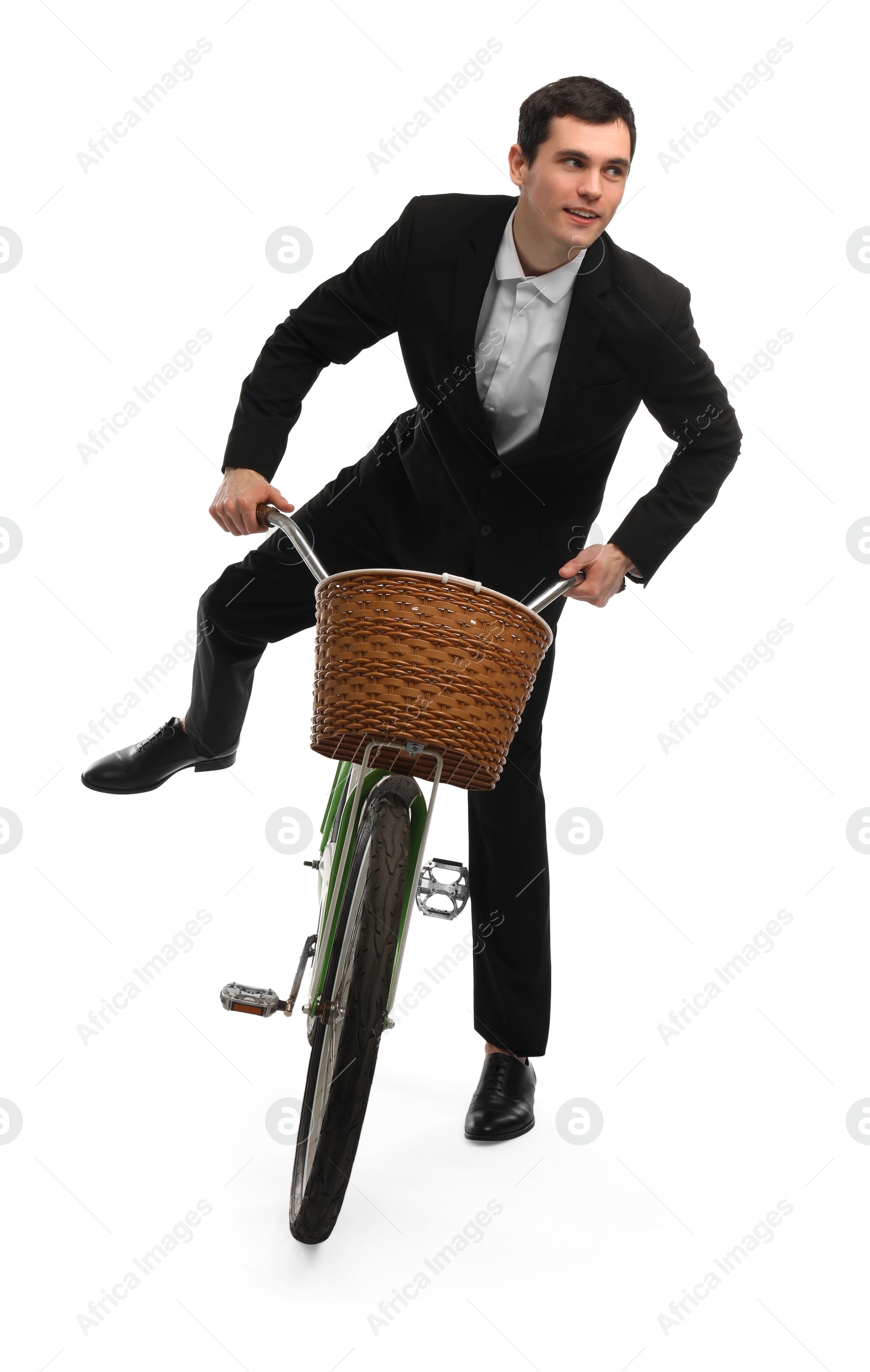 Photo of Smiling man on bicycle with basket against white background