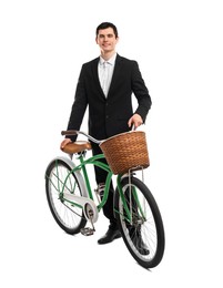 Smiling man with bicycle and basket isolated on white