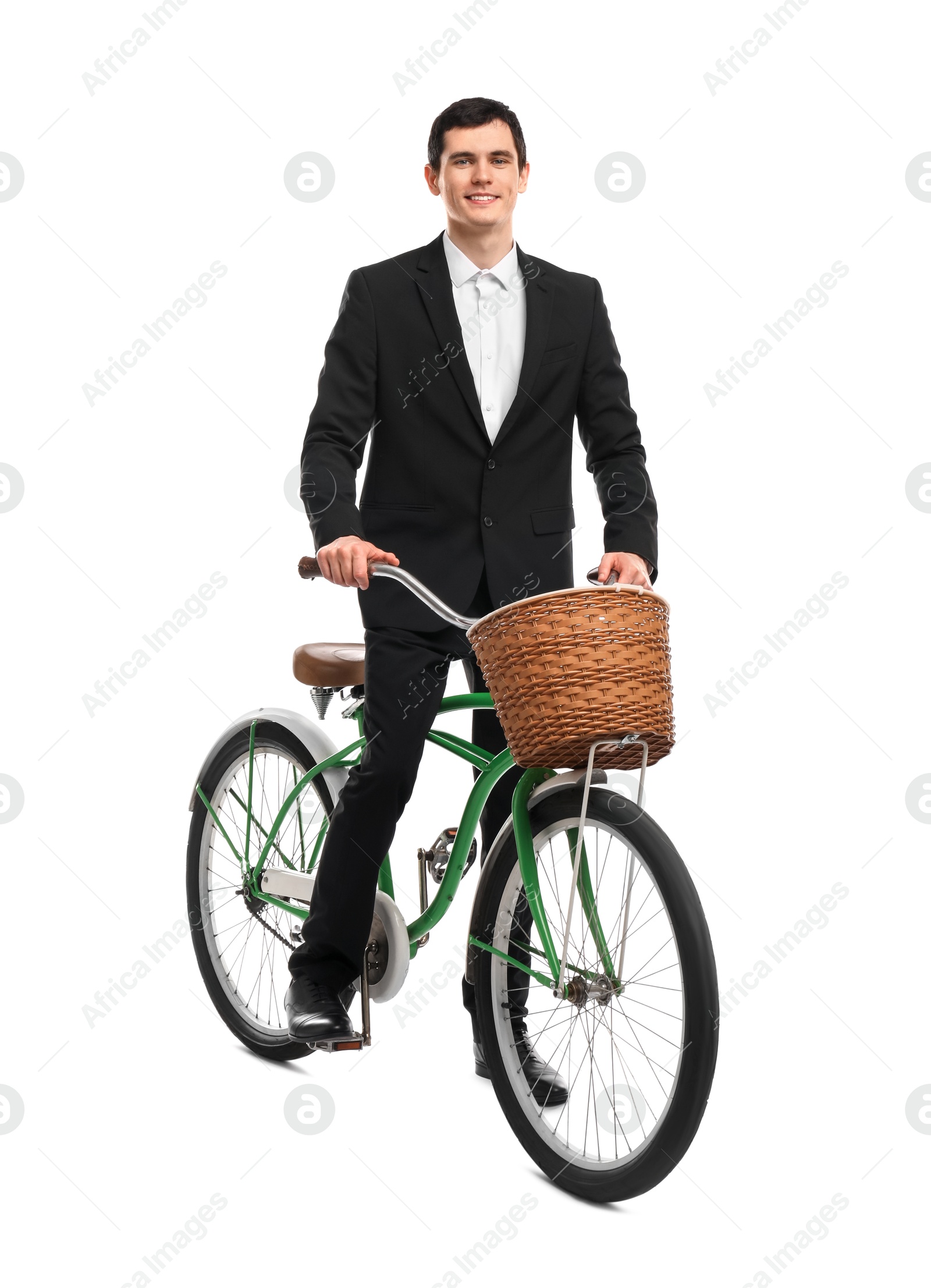 Photo of Smiling man on bicycle with basket against white background