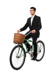 Photo of Man riding bicycle with basket isolated on white