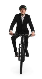 Smiling man in helmet riding bicycle on white background