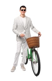 Smiling man in sunglasses with bicycle and basket isolated on white