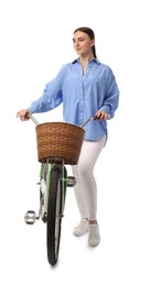 Beautiful young woman with bicycle and basket isolated on white