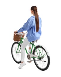 Woman riding bicycle with basket isolated on white