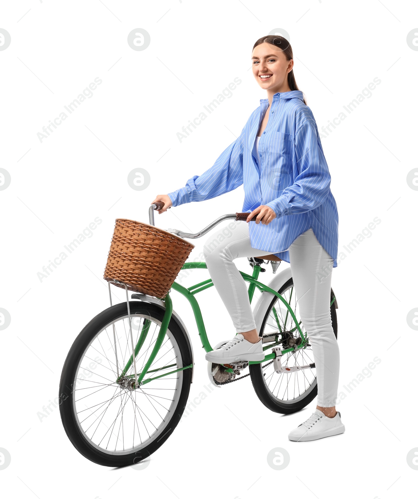 Photo of Smiling woman on bicycle with basket against white background