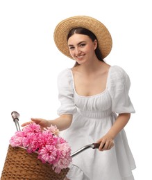 Smiling woman with bicycle and basket of peony flowers isolated on white