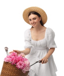 Photo of Smiling woman with bicycle and basket of peony flowers isolated on white