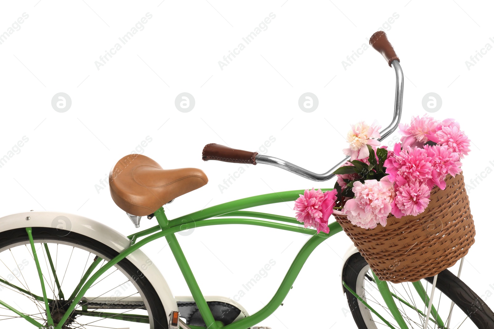 Photo of Bicycle with basket of pink peony flowers isolated on white