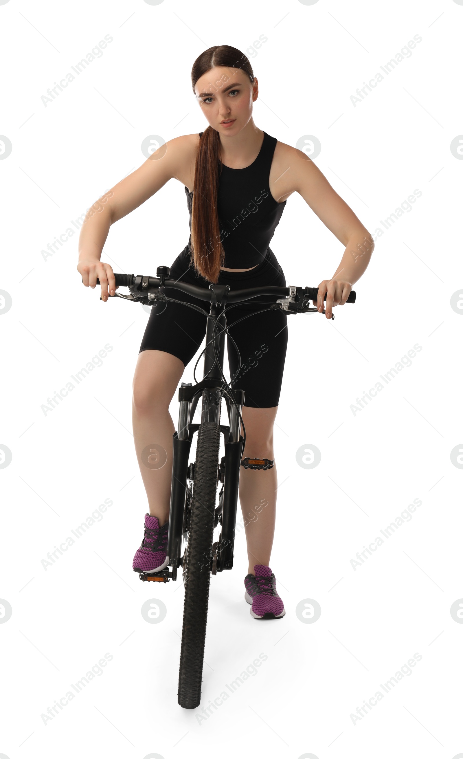 Photo of Beautiful young woman on bicycle against white background