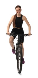 Photo of Smiling woman riding bicycle on white background