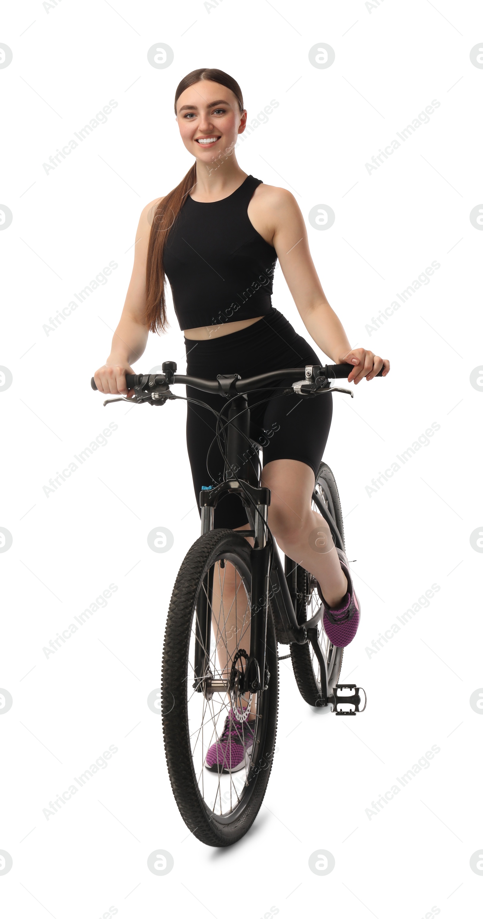 Photo of Smiling woman riding bicycle on white background