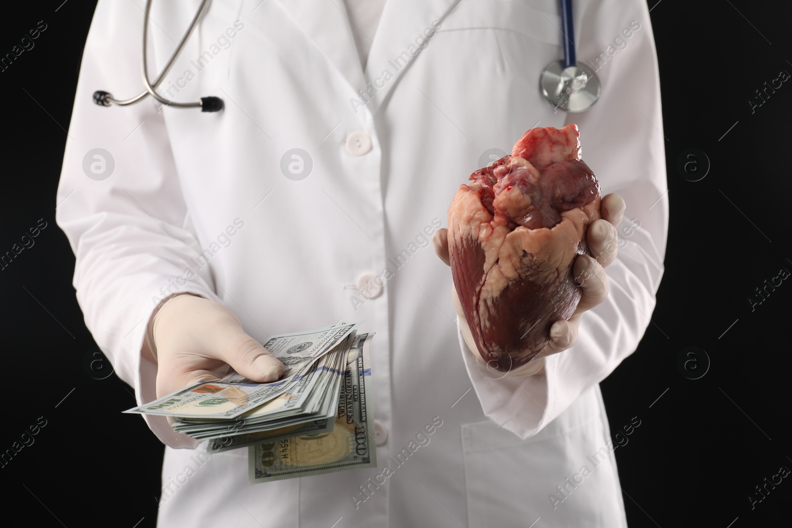 Photo of Doctor with heart and dollar banknotes on black background, closeup