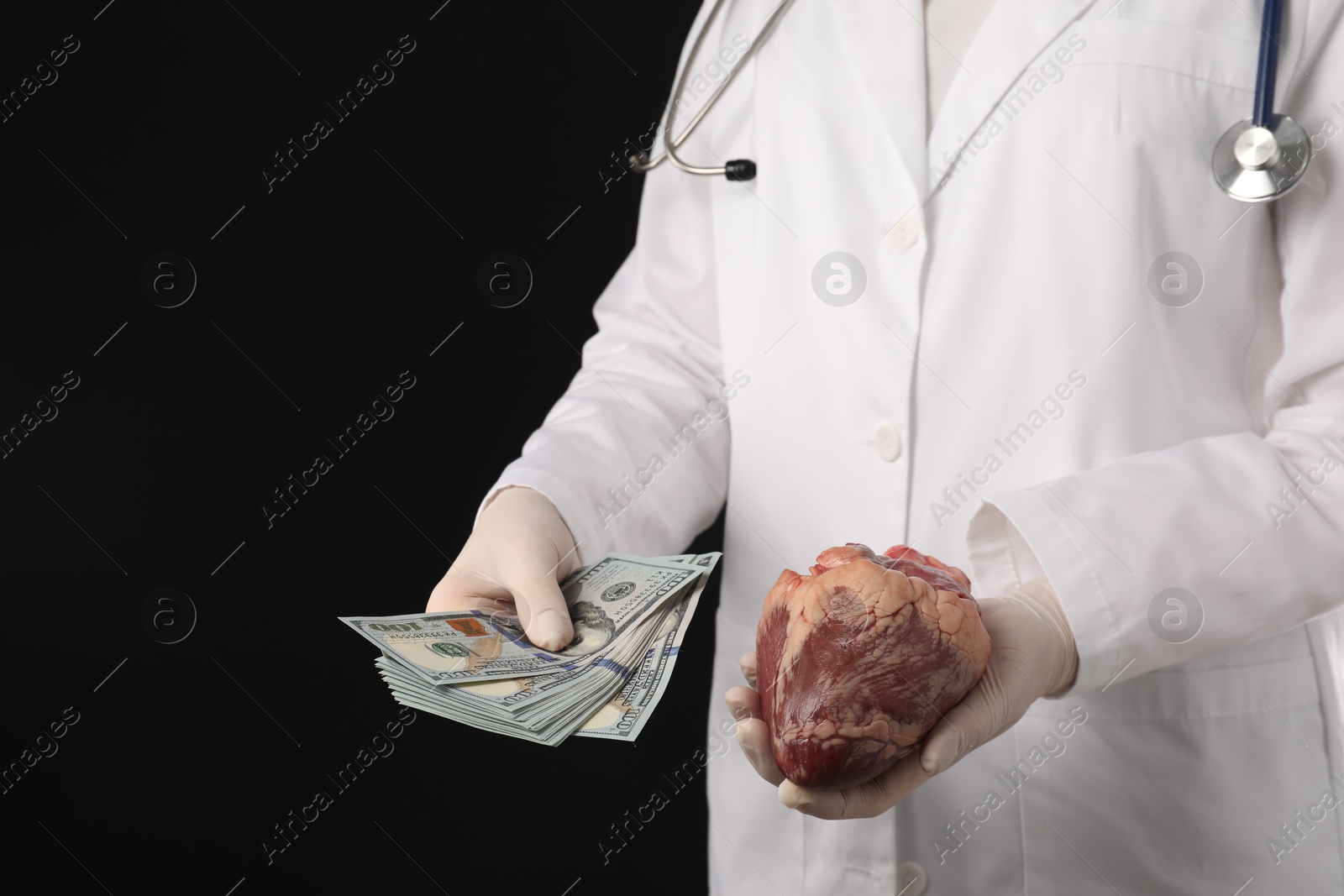 Photo of Doctor with heart and dollar banknotes on black background, closeup