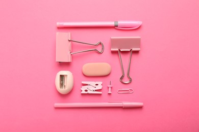 Photo of Flat lay composition with different stationery on pink background