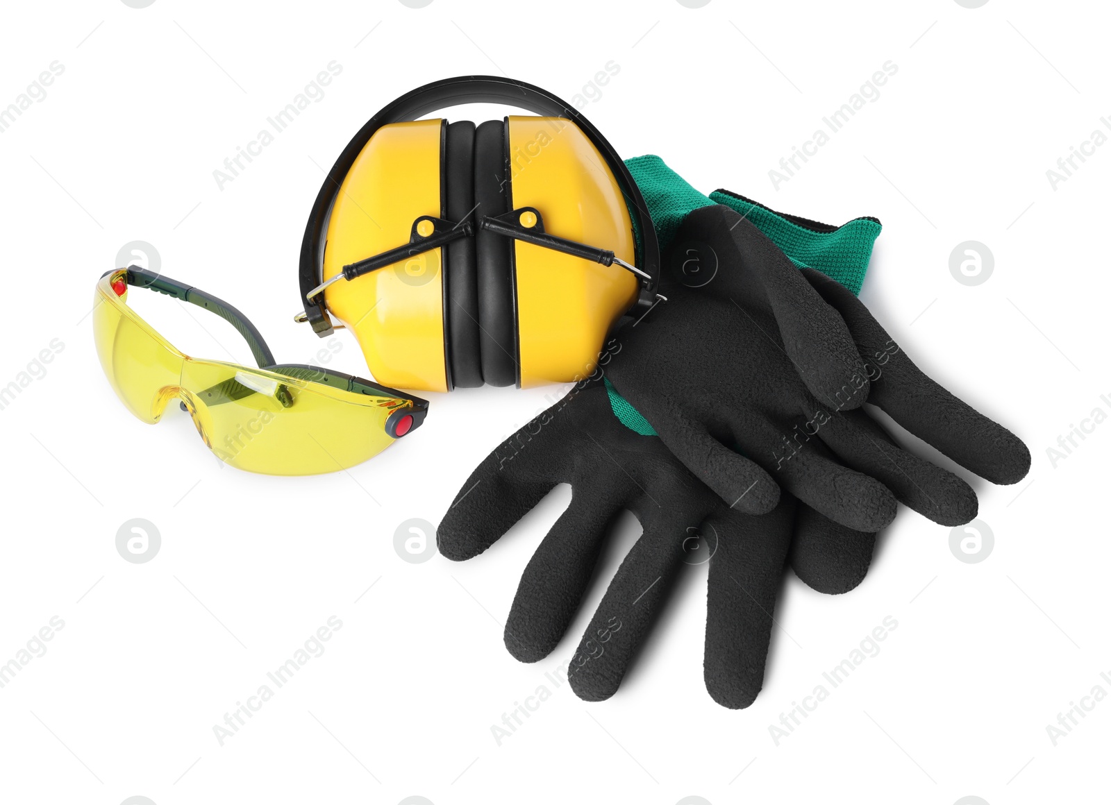 Photo of Earmuffs, protective gloves and goggles isolated on white, top view