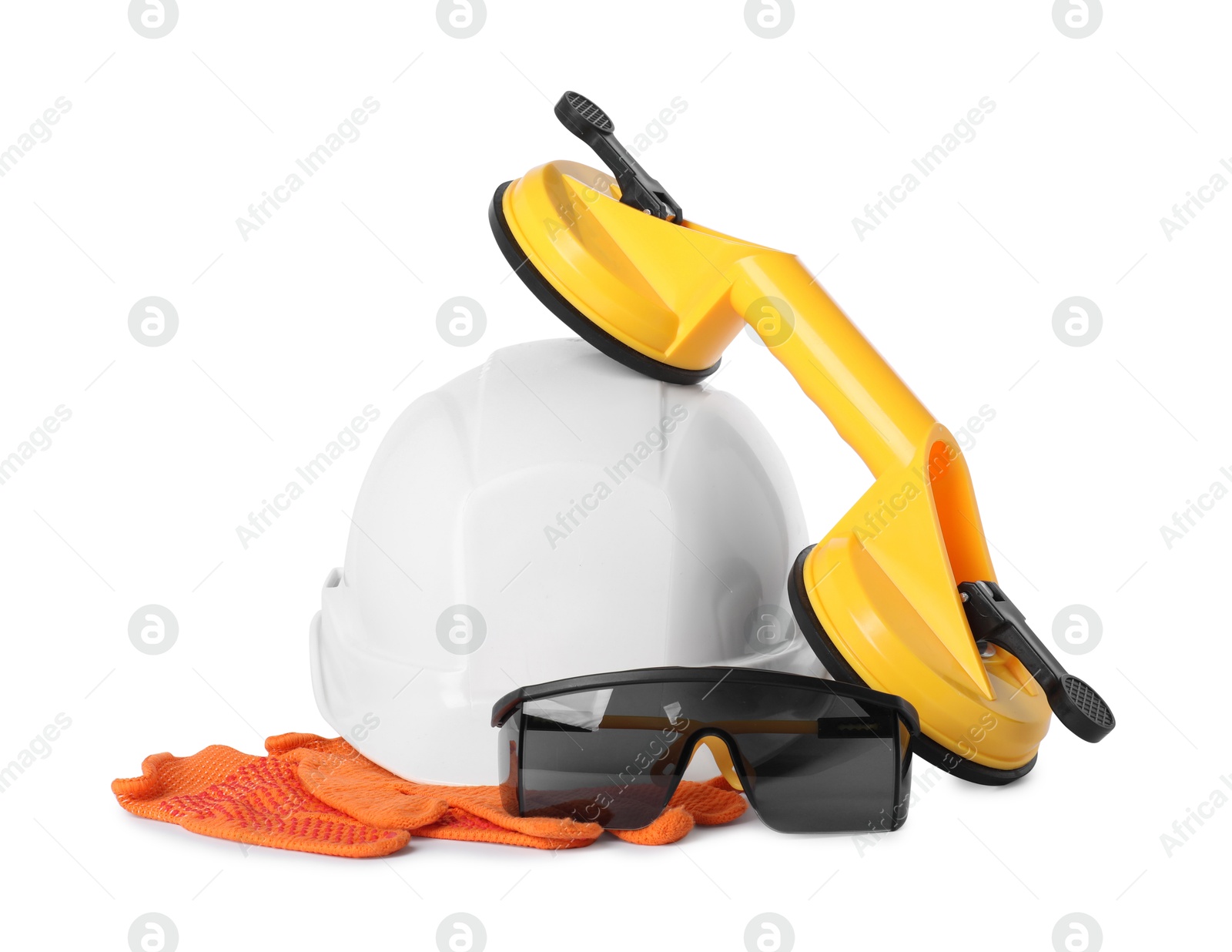 Photo of Hard hat, protective gloves, goggles and glass suction cups isolated on white