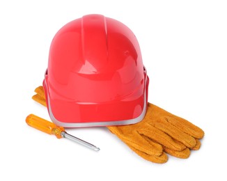 Photo of Hard hat, protective gloves and screwdriver isolated on white