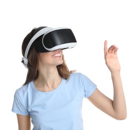 Smiling woman using virtual reality headset on white background