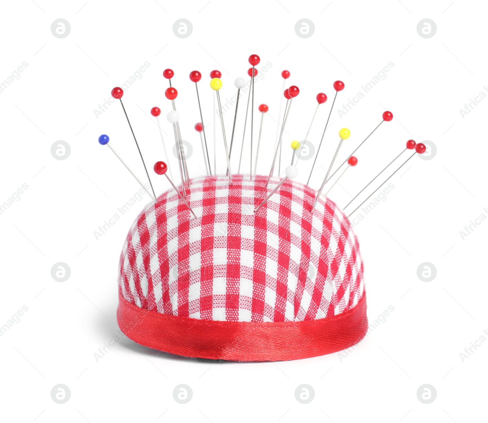 Photo of Checkered pincushion with sewing pins isolated on white