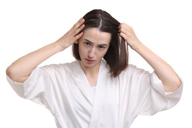 Young woman with hair loss problem on white background