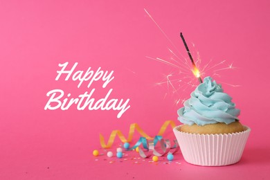 Image of Birthday cupcake with sparkler on pink background. Greeting card