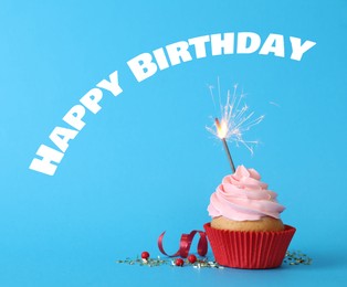 Image of Birthday cupcake with sparkler on light blue background. Greeting card