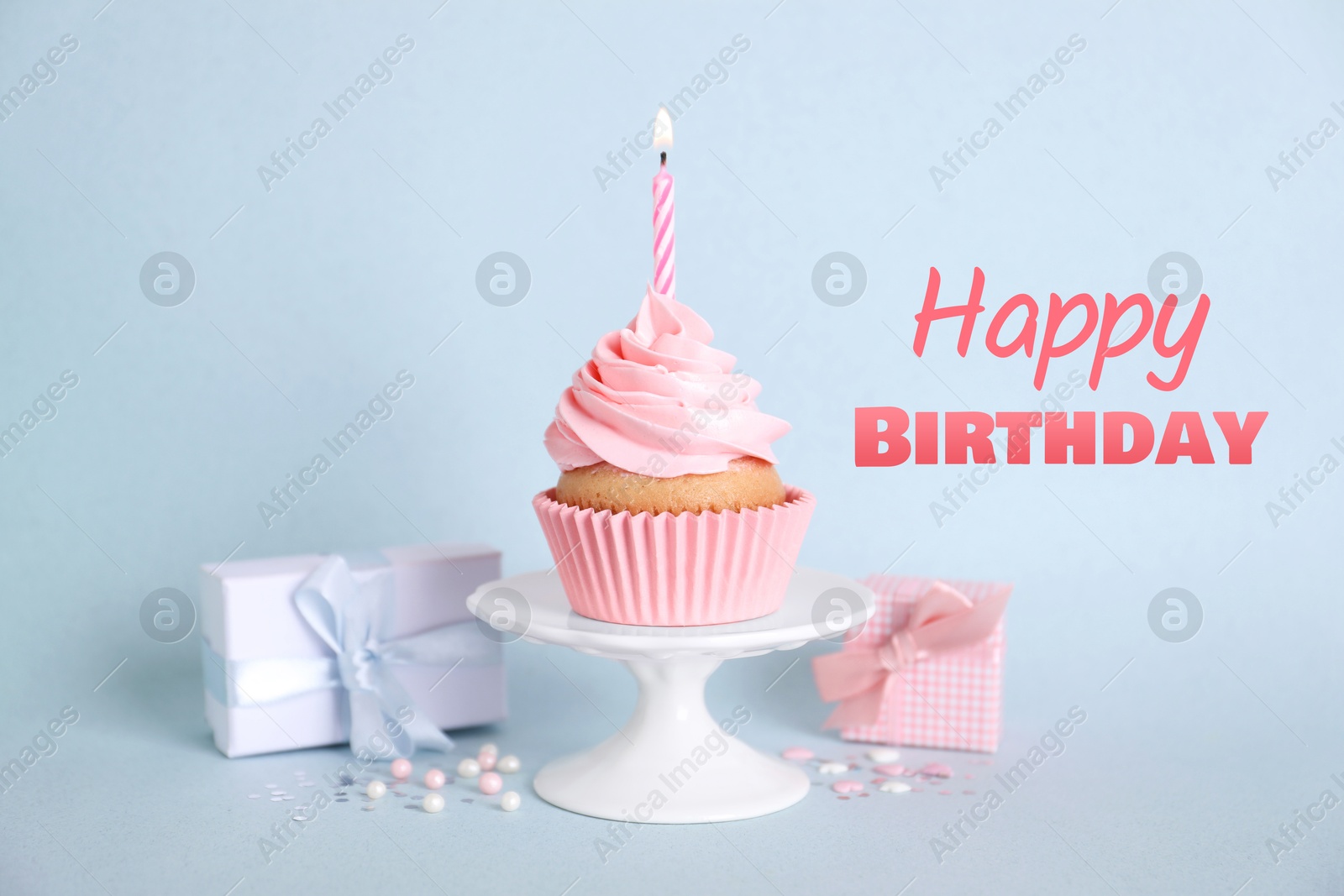 Image of Birthday card with cupcake and gift boxes on light blue background