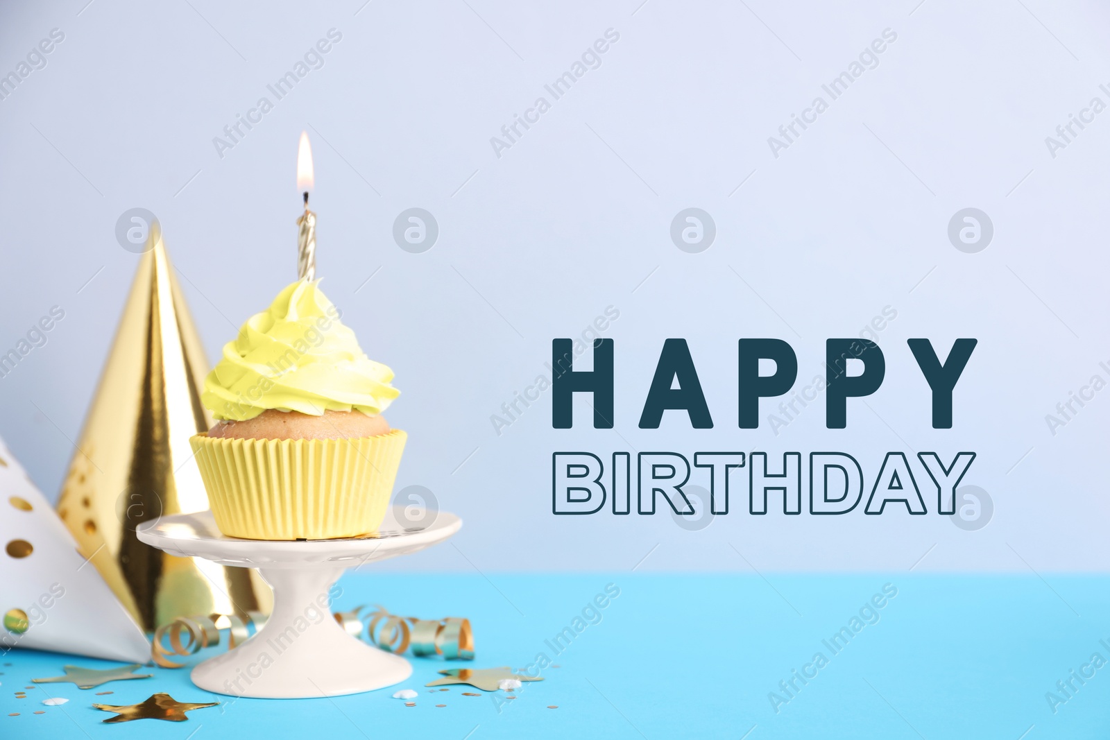 Image of Birthday card with cupcake and party hats on light blue background