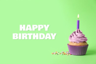 Image of Happy Birthday. Cupcake with candle on green background