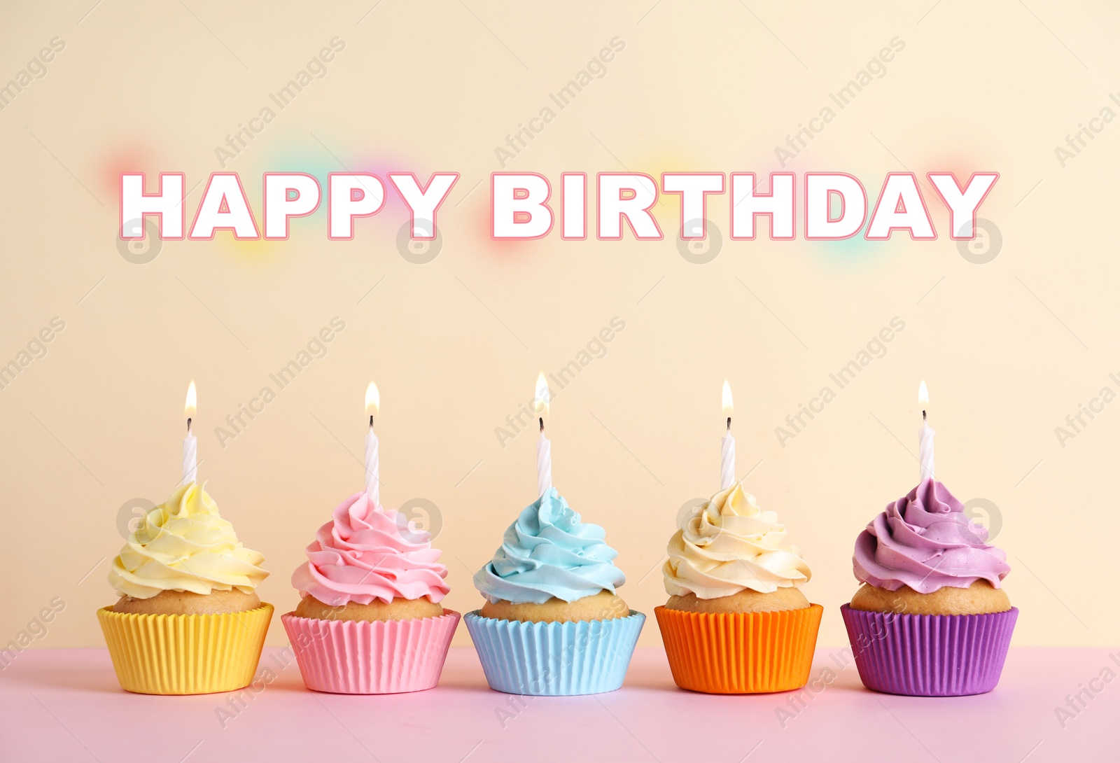 Image of Happy Birthday. Colorful cupcakes with candles on beige background