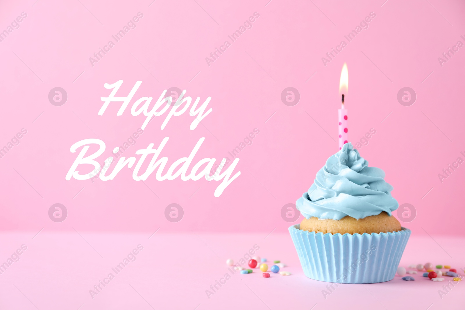 Image of Birthday cupcake with candle on pink background. Greeting card