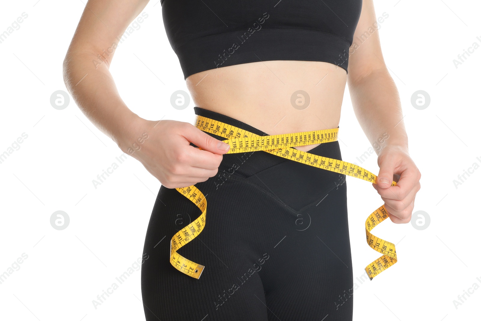 Photo of Woman with measuring tape showing her slim body against white background, closeup