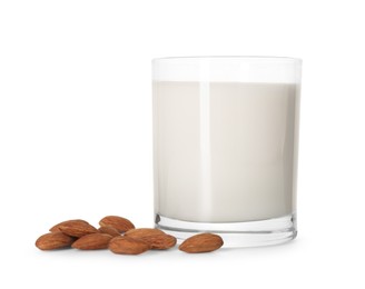 Glass of almond milk and almonds isolated on white