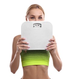 Photo of Woman with floor scale on white background