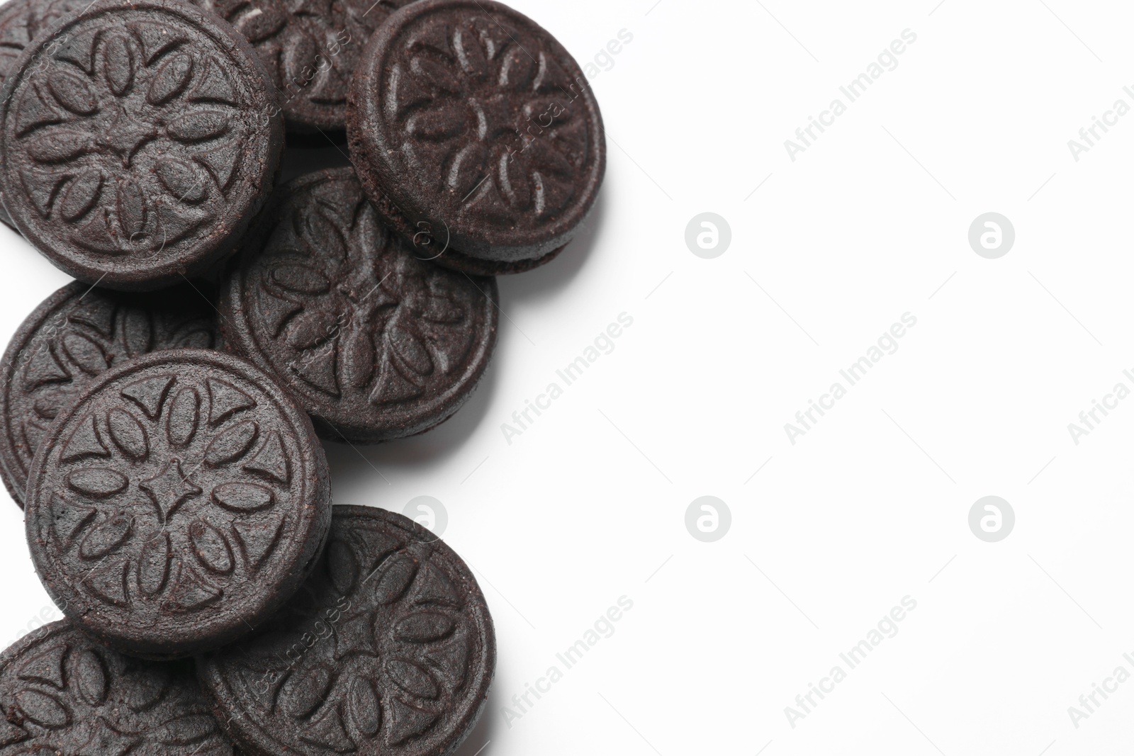 Photo of Tasty sweet sandwich cookies on white background, flat lay. Space for text