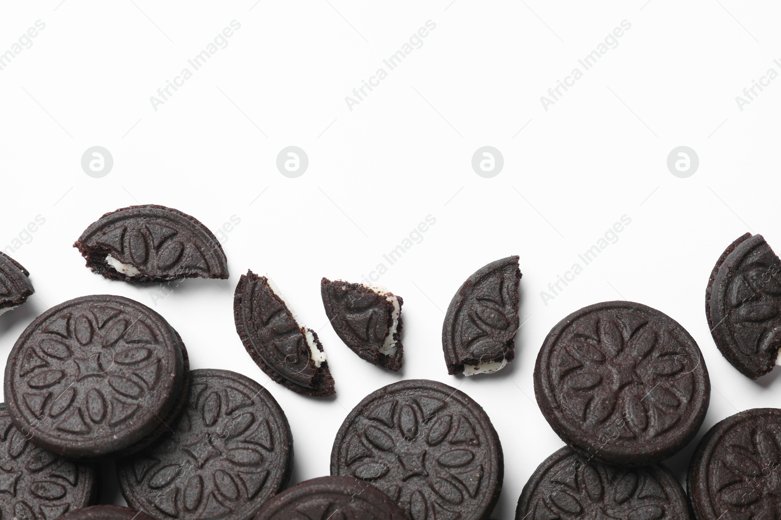 Photo of Tasty sweet sandwich cookies on white background, flat lay. Space for text