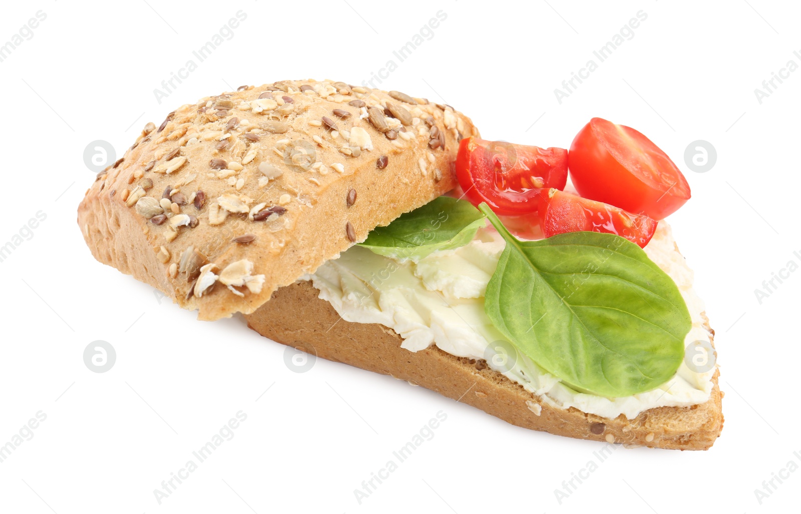 Photo of Pieces of bread with cream cheese, basil leaves and tomato isolated on white