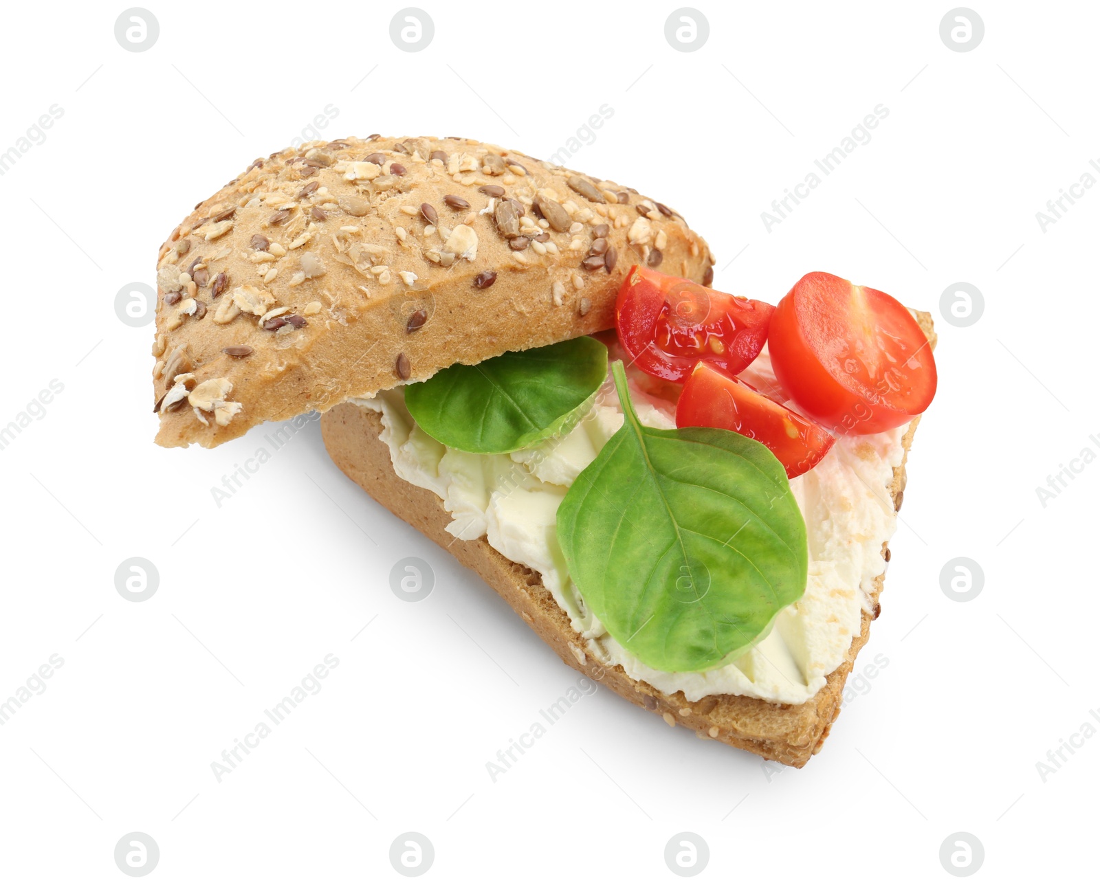 Photo of Pieces of bread with cream cheese, basil leaves and tomato isolated on white