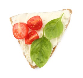 Photo of Piece of bread with cream cheese, basil leaves and tomato isolated on white, top view