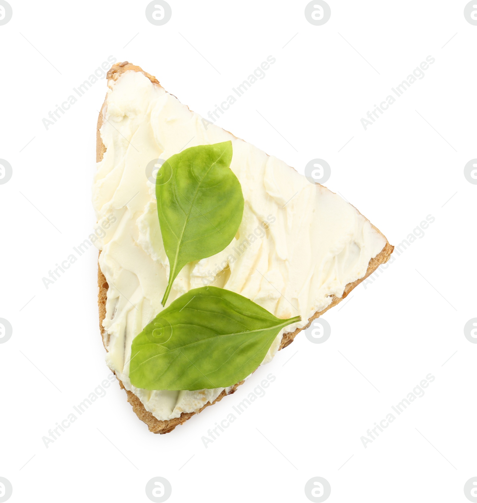 Photo of Piece of bread with cream cheese and basil leaves isolated on white, top view