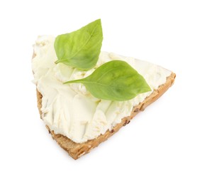 Photo of Piece of bread with cream cheese and basil leaves isolated on white