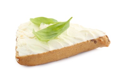 Photo of Piece of bread with cream cheese and basil leaves isolated on white