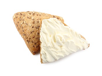 Photo of Pieces of bread with cream cheese isolated on white